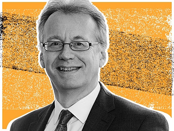 guy goodwin against orange graphic background